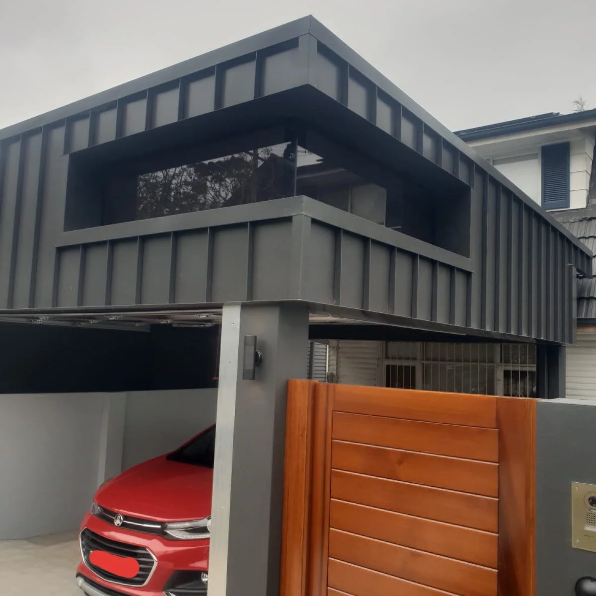 Custom made corner window with architectural cladding